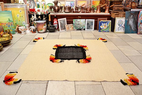 Hand-woven square rug