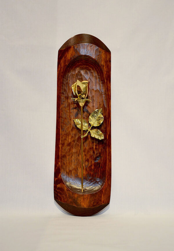 Brass rose on a pine wooden base for wall decoration