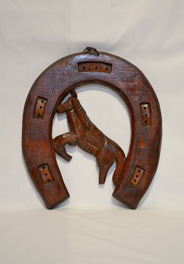 Horseshoe wood carving