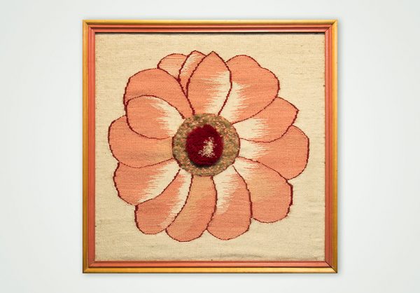 hand woven textile wall panel in a frame flower