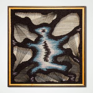 hand woven textile wall panel in a frame spider
