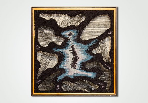 hand woven textile wall panel in a frame spider